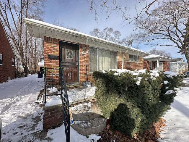 view of front of home featuring brick siding