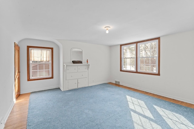 unfurnished bedroom with visible vents and baseboards