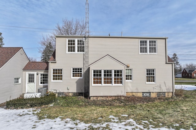 back of property featuring central AC