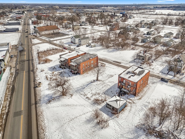 snowy aerial view featuring a residential view