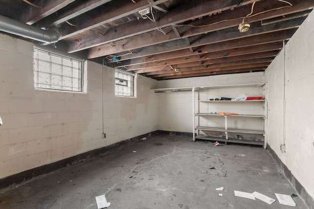 basement featuring concrete block wall