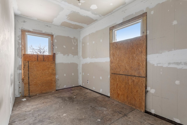 spare room with a healthy amount of sunlight