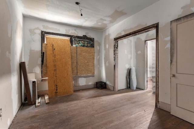 empty room featuring hardwood / wood-style flooring