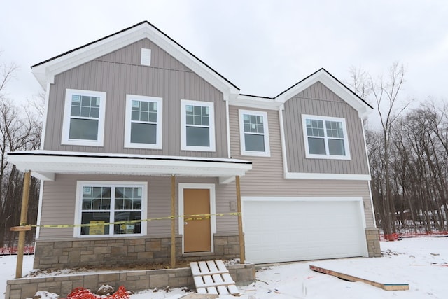 view of front of home with stone siding and board and batten siding