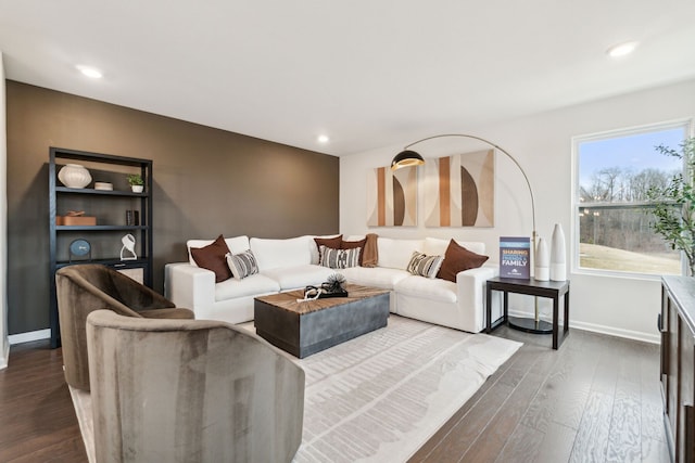 living area with recessed lighting, baseboards, and dark wood-style flooring