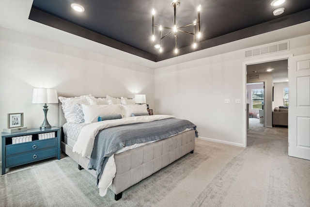 bedroom featuring visible vents, baseboards, carpet, and a raised ceiling