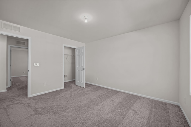 4278 Oak St, Grand Blanc, MI 48439 - unfurnished bedroom with baseboards, visible vents, and carpet