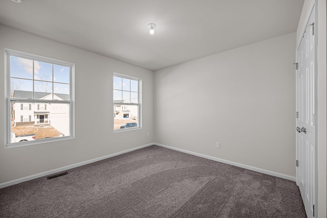 4278 Oak St, Grand Blanc, MI 48439 - unfurnished bedroom featuring visible vents, carpet flooring, and baseboards
