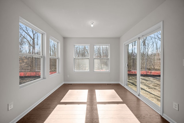 4278 Oak St, Grand Blanc, MI 48439 - unfurnished sunroom featuring baseboards, wood finished floors, and a healthy amount of sunlight