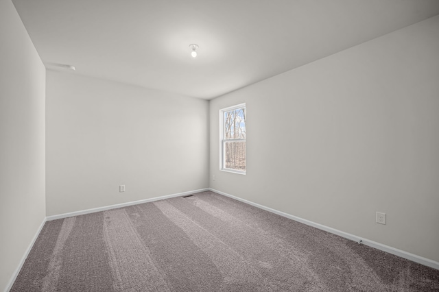 4278 Oak St, Grand Blanc, MI 48439 - unfurnished room with baseboards, carpet flooring, and visible vents