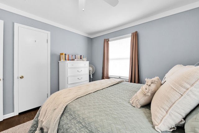 bedroom featuring ceiling fan and wood finished floors