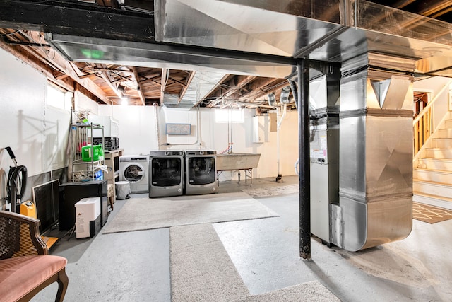 basement featuring stairs and independent washer and dryer