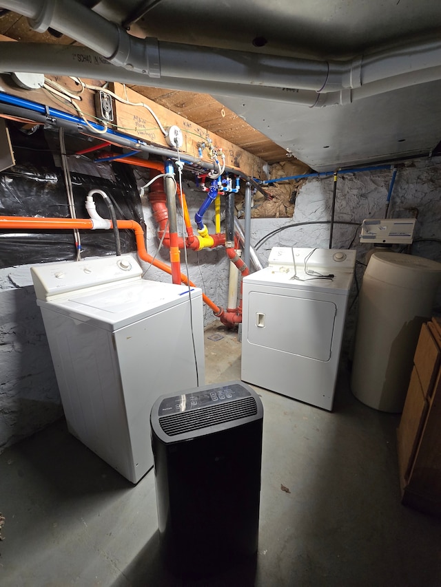 washroom featuring laundry area and separate washer and dryer