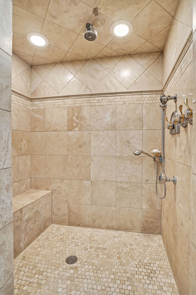 bathroom featuring a tile shower and recessed lighting