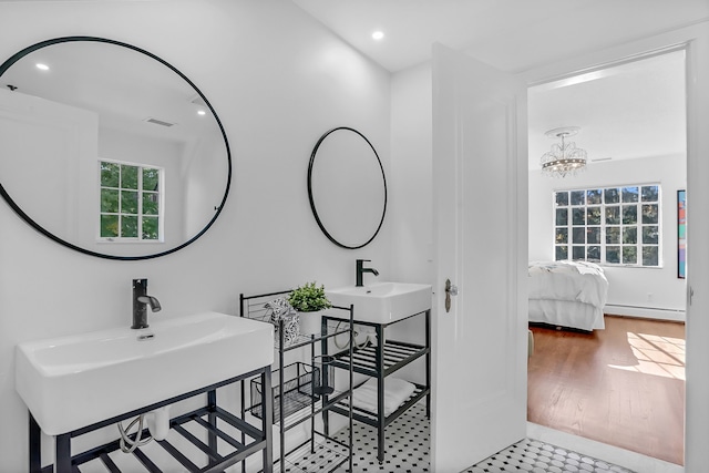 full bathroom featuring a baseboard radiator, visible vents, ensuite bath, and recessed lighting