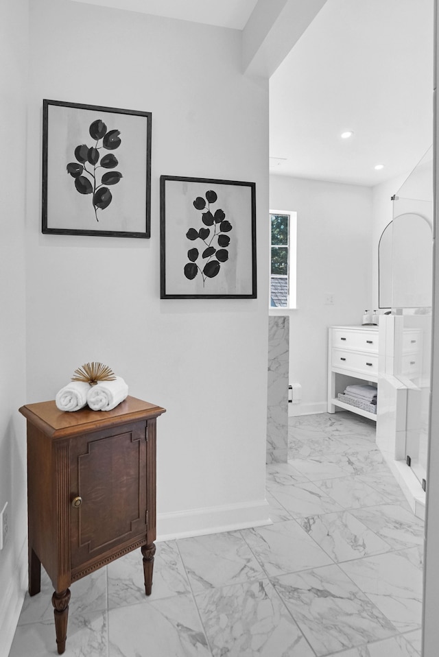 bathroom featuring recessed lighting, marble finish floor, and baseboards