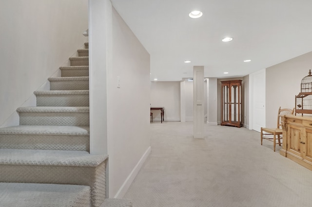 stairway featuring baseboards, carpet flooring, and recessed lighting