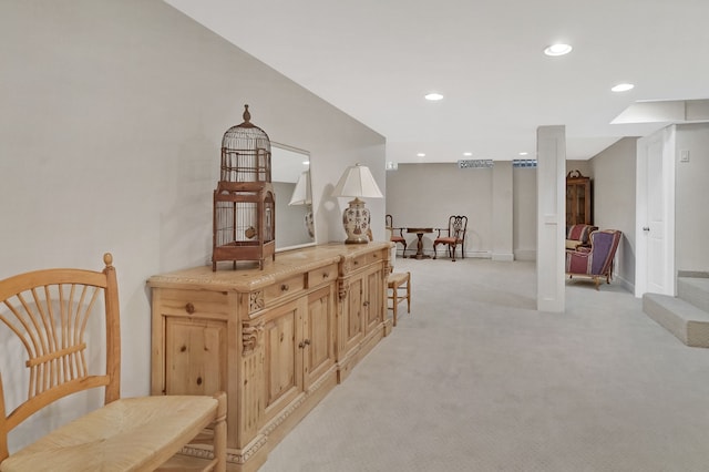 interior space with recessed lighting, light carpet, and baseboards