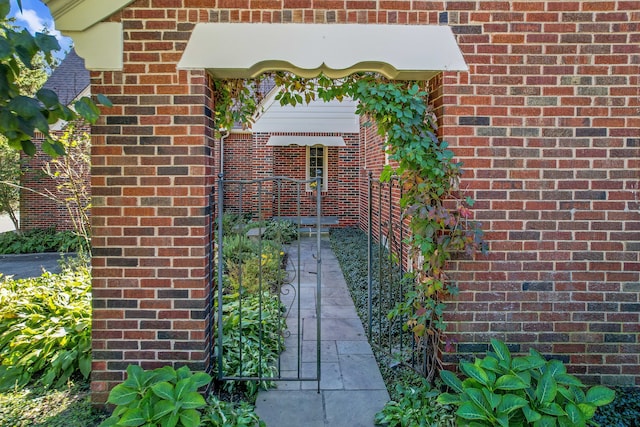 entrance to property with brick siding