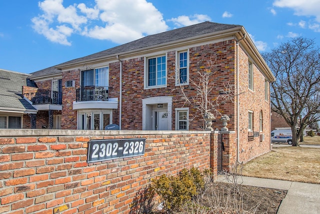 view of front of house with brick siding