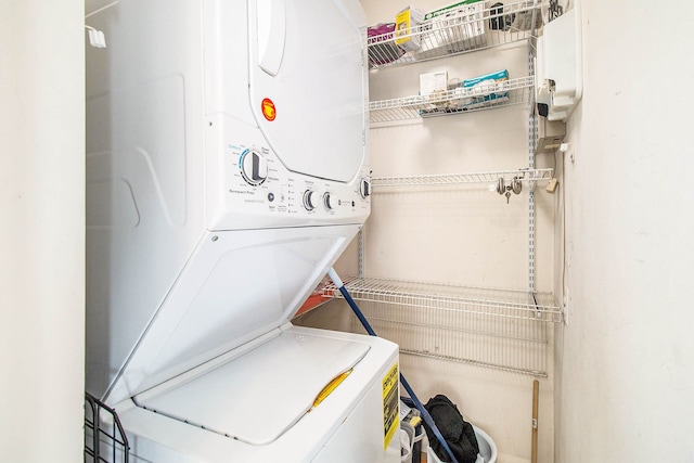 washroom with laundry area and stacked washer and clothes dryer