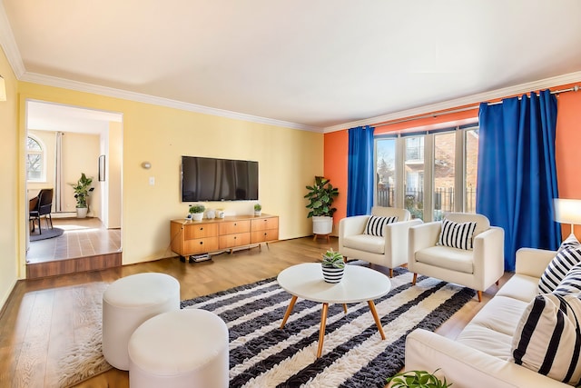 living area featuring plenty of natural light, wood finished floors, and crown molding