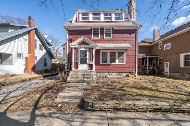 traditional style home with a chimney