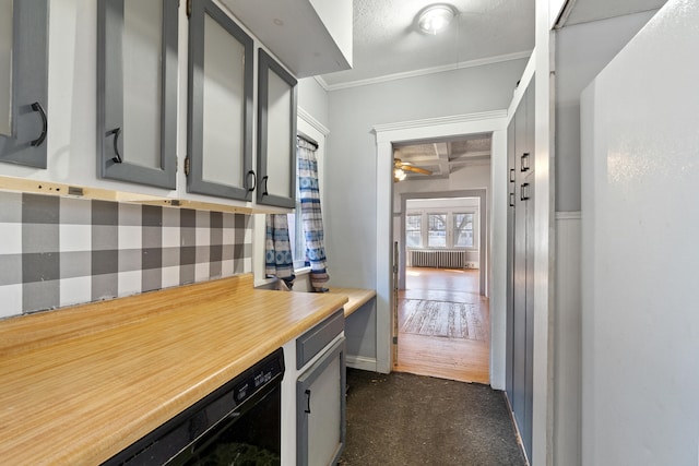 interior space with a ceiling fan, radiator heating unit, light countertops, dark colored carpet, and gray cabinetry