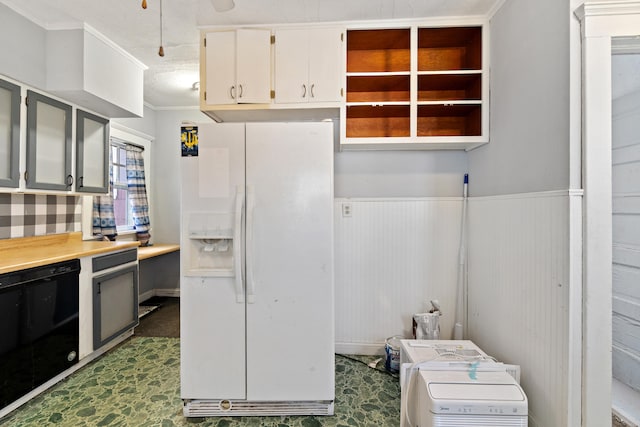 kitchen with white refrigerator with ice dispenser, light countertops, wainscoting, white cabinets, and dishwasher