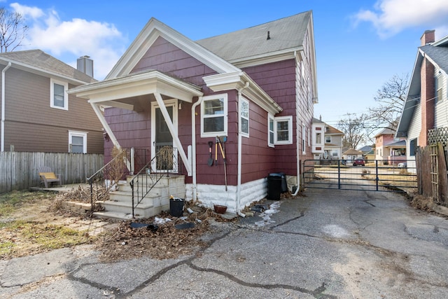 view of front of house featuring fence