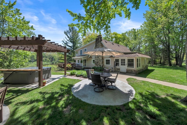 12260 183rd Ave, Big Rapids, MI 49307 - rear view of house with a hot tub, a pergola, a patio, and a lawn