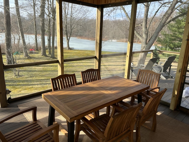 sunroom with a water view and plenty of natural light