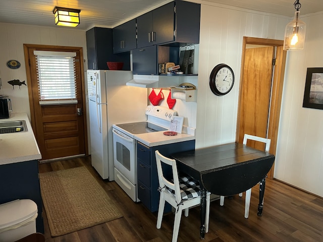 kitchen with dark wood-type flooring, white range with electric stovetop, light countertops, and a sink