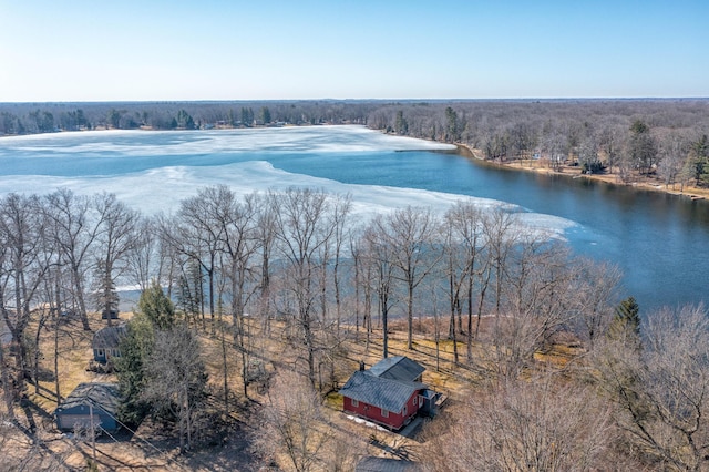 aerial view with a forest view and a water view