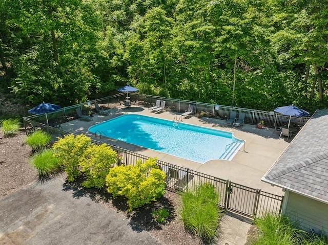 pool featuring a patio area and fence