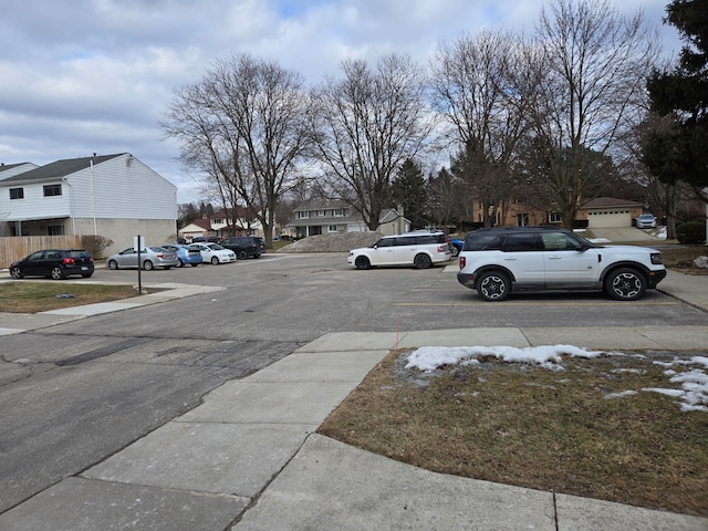 view of road with sidewalks and a residential view