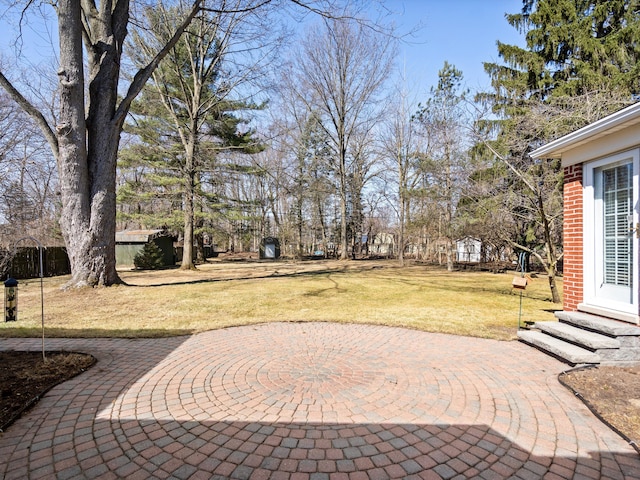 exterior space with a yard and a patio area