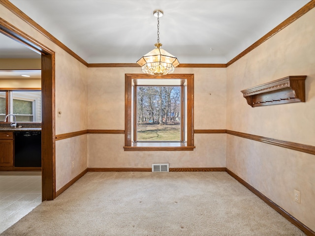 unfurnished dining area featuring baseboards, visible vents, a sink, light carpet, and a notable chandelier