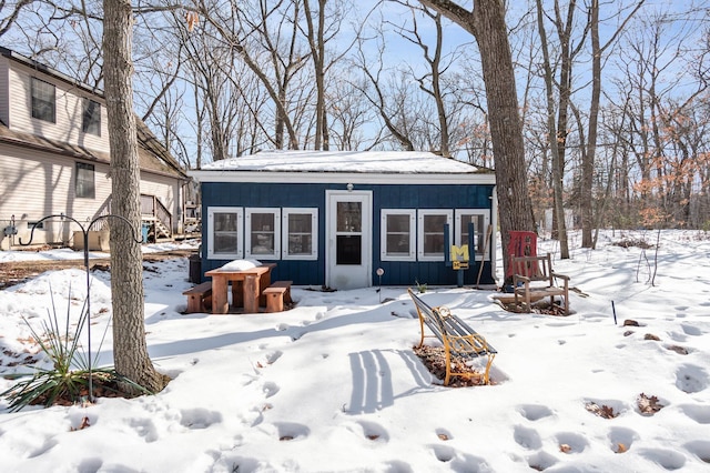 rear view of house featuring a garage