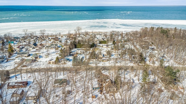 drone / aerial view featuring a water view and a beach view