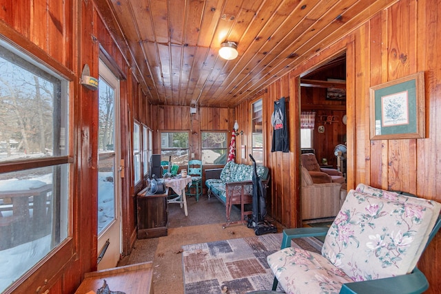 interior space with wood ceiling and wooden walls