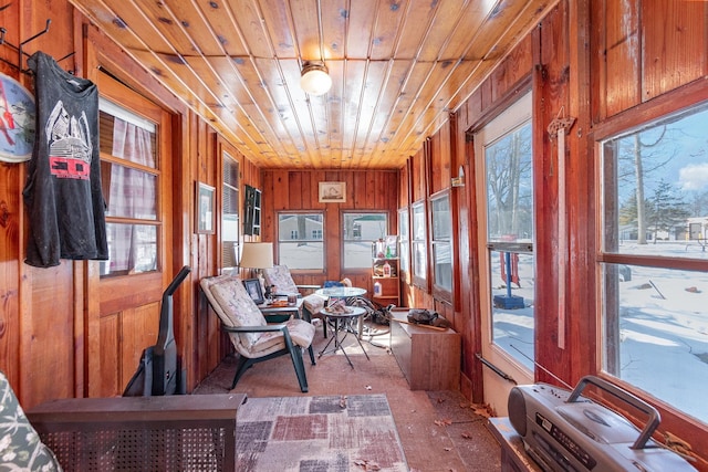 sunroom / solarium featuring wooden ceiling and a wealth of natural light