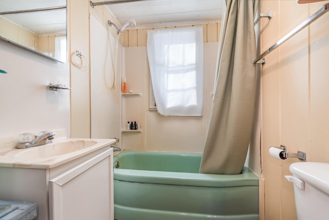 full bath with shower / tub combo, vanity, and toilet