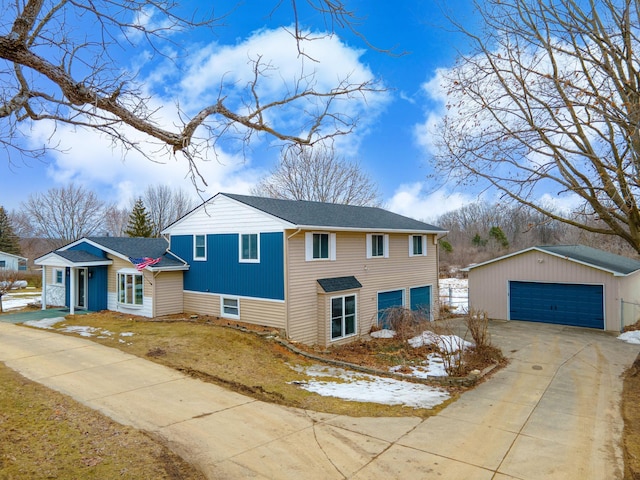 view of front of home with a detached garage and an outdoor structure