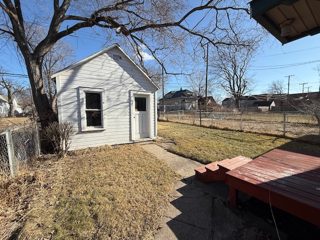 view of yard featuring a fenced backyard and an outdoor structure