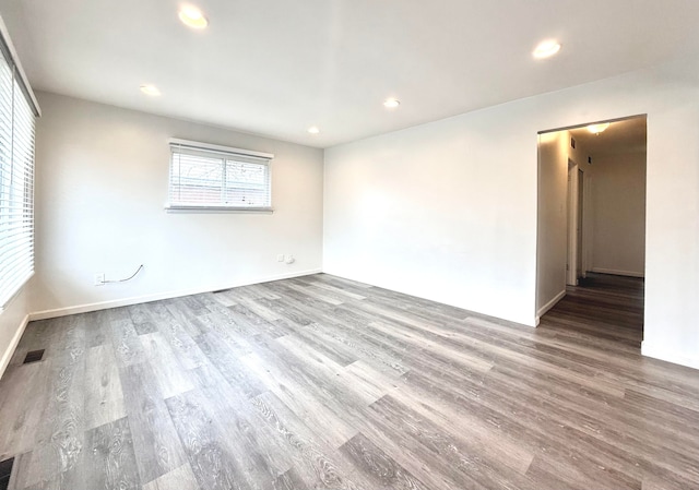 spare room with visible vents, wood finished floors, and recessed lighting