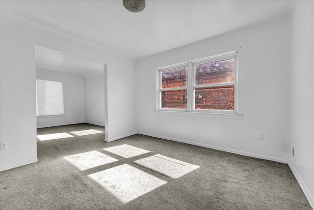 spare room with carpet floors and baseboards