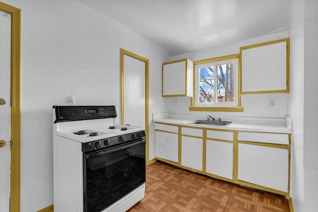 kitchen with white cabinetry, light countertops, a sink, and white electric range oven