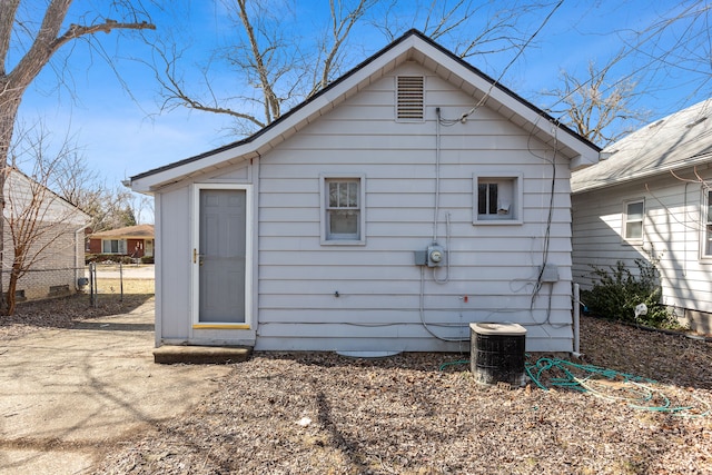 back of house featuring central air condition unit