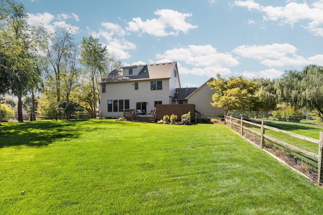 view of yard with fence and a deck